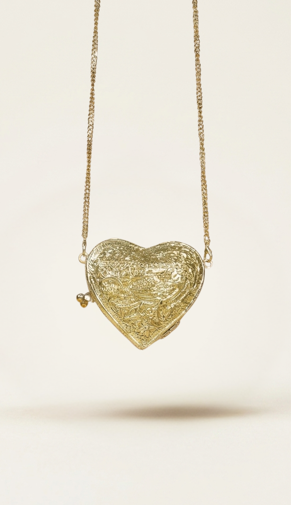 The Amour minaudière carried by a model, styled for evening
