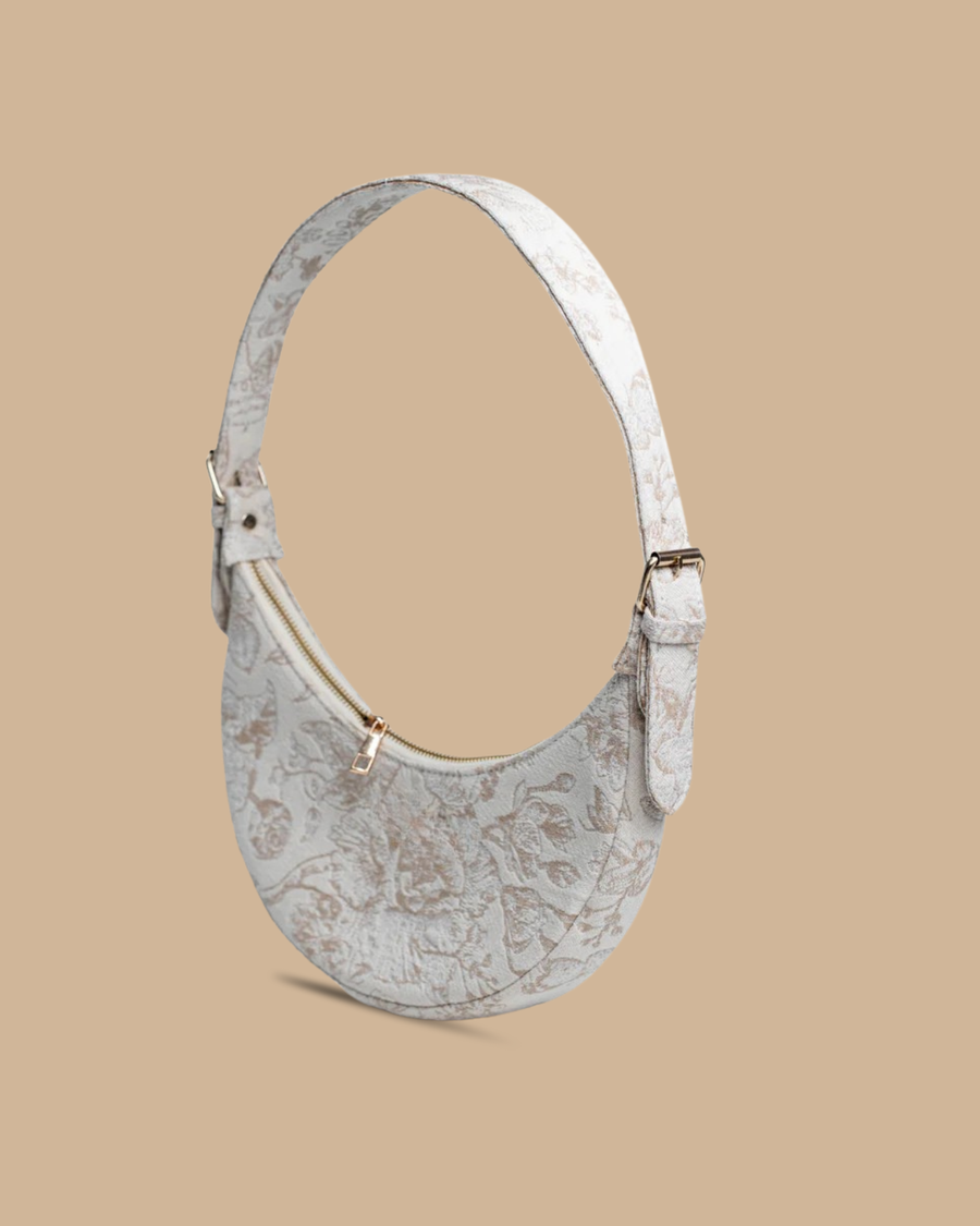 The Flora block-print shoulder bag — side view of the crescent shoulder bag in hand-blocked fabric