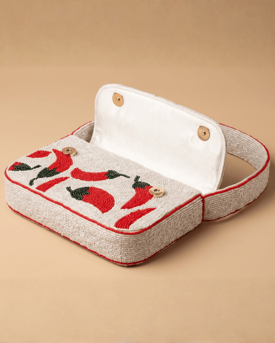 The Cayenne opened to reveal its cream cotton lining and two wooden button closures.