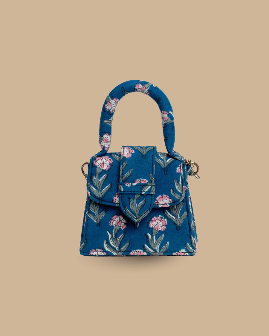 The Soir block-print mini top-handle bag — front view of the petite blue floral hand-blocked bag