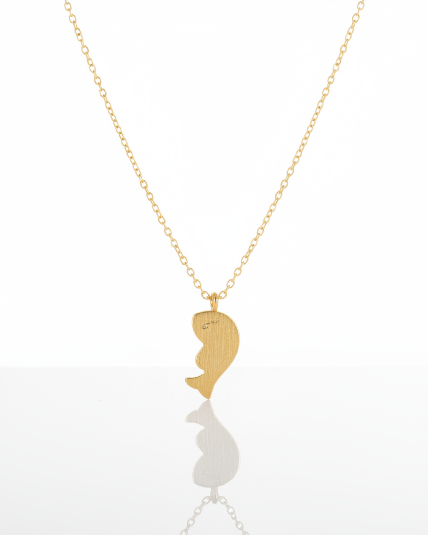 Back of The Mosaic Koi Pendant showing the matte-gold koi fish silhouette.
