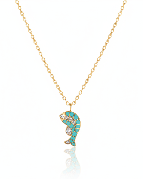 Turquoise Koi Pendant carried by a model, styled for evening