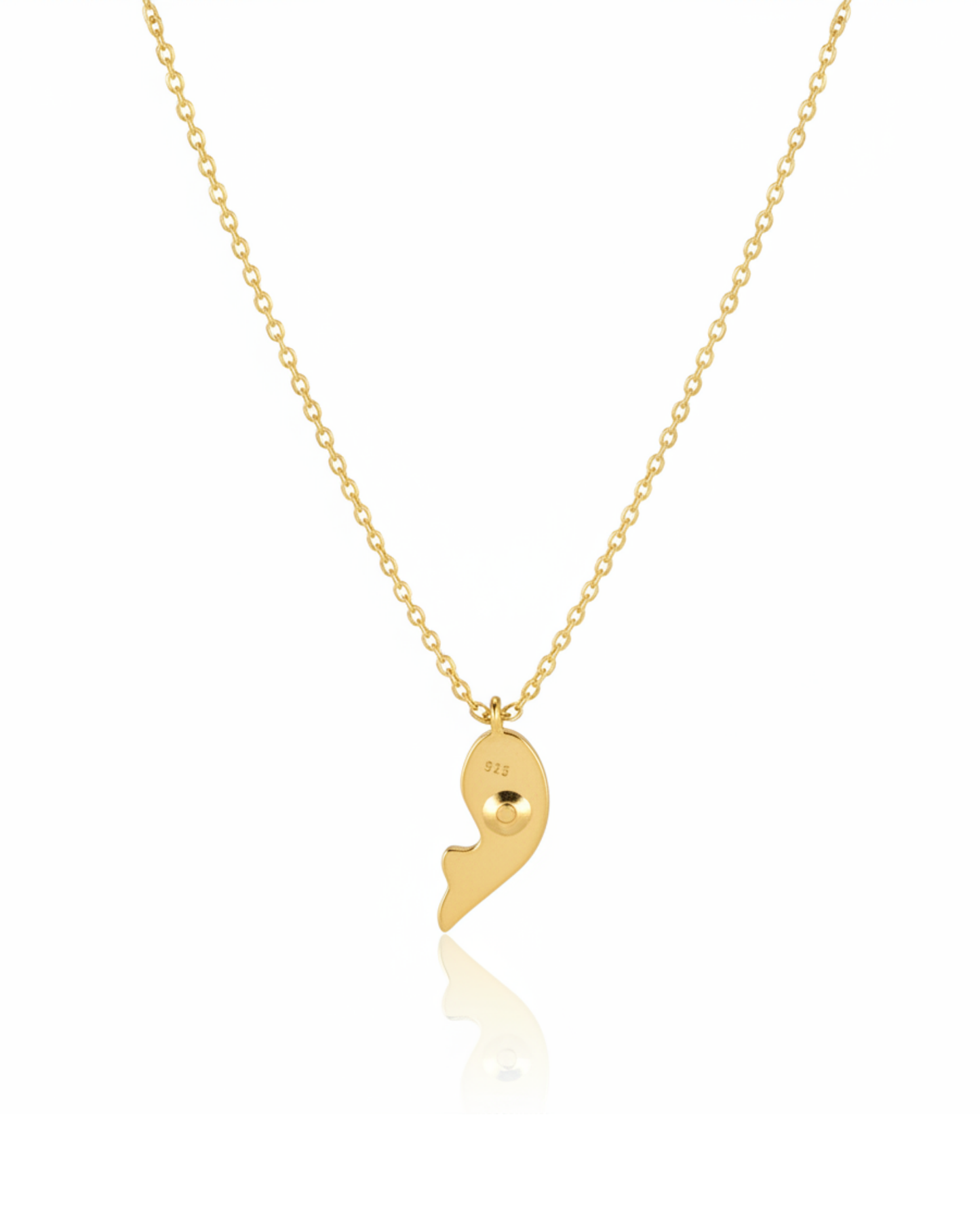 Back of The Royal Indigo Koi Pendant showing the polished-gold koi fish silhouette.