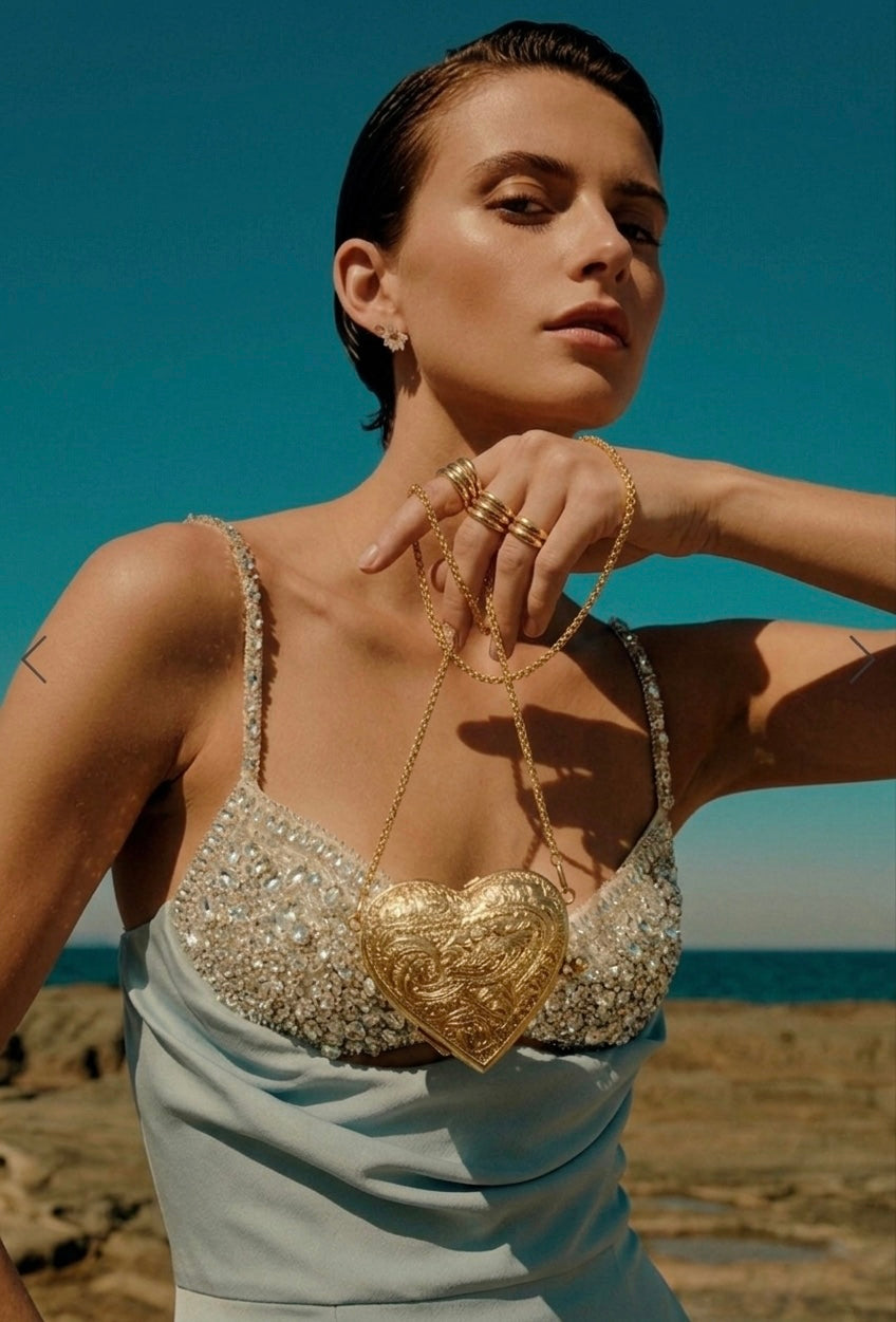The Amour minaudière worn by a model as an evening accessory
