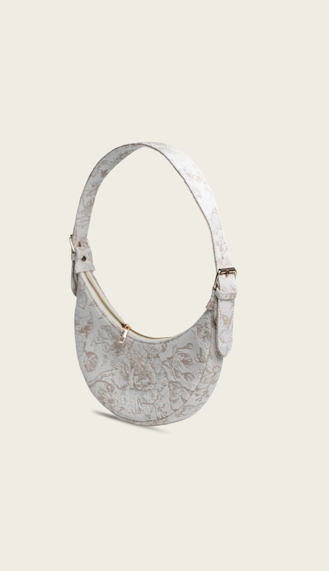 The Flora handbag carried by a model, styled for evening