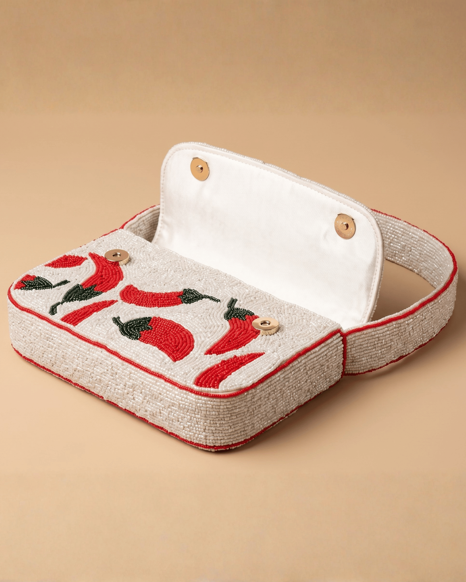 The Cayenne opened to reveal its cream cotton lining and two wooden button closures.