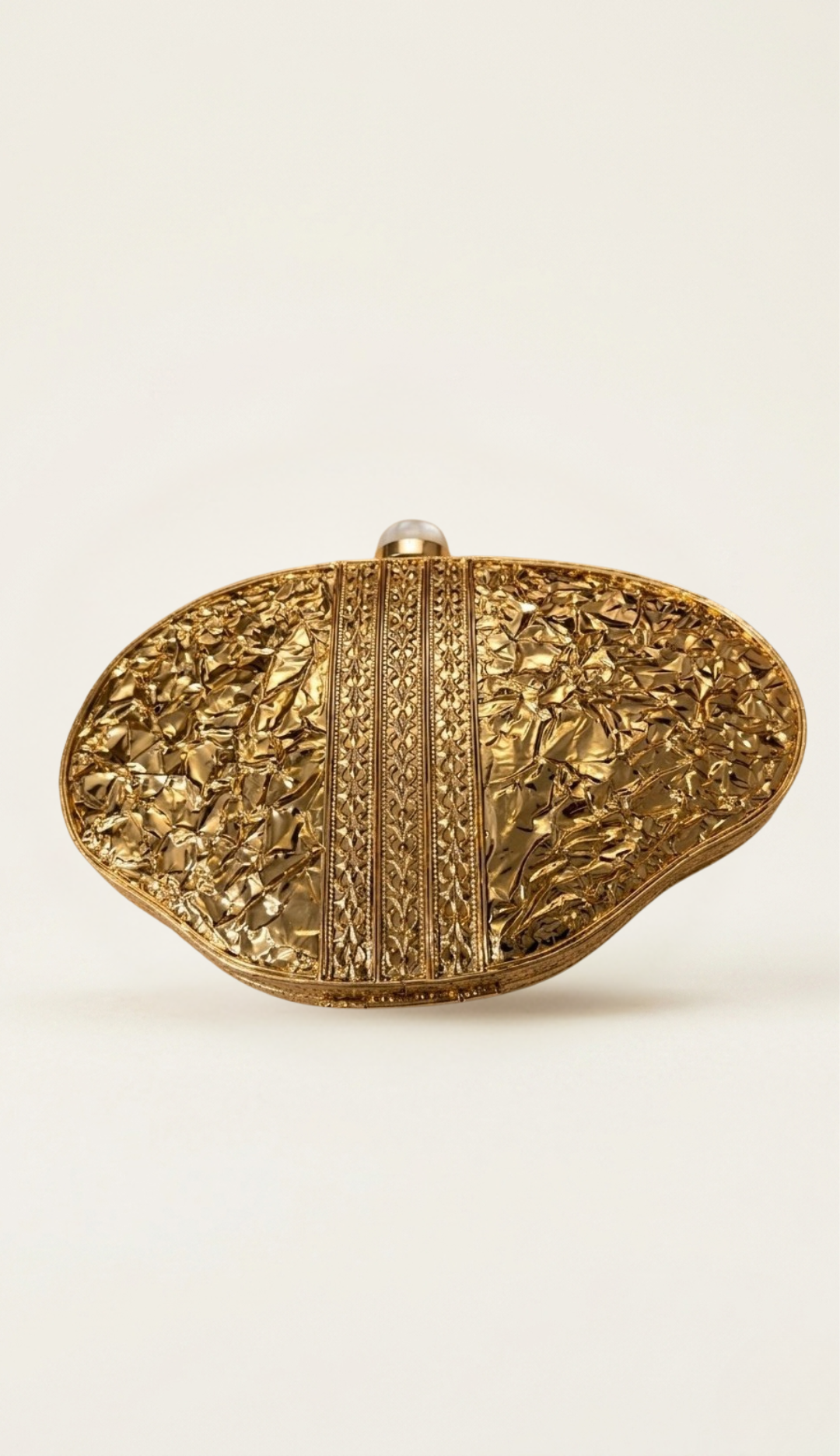 The Ormolu shell clutch, three-quarter view
