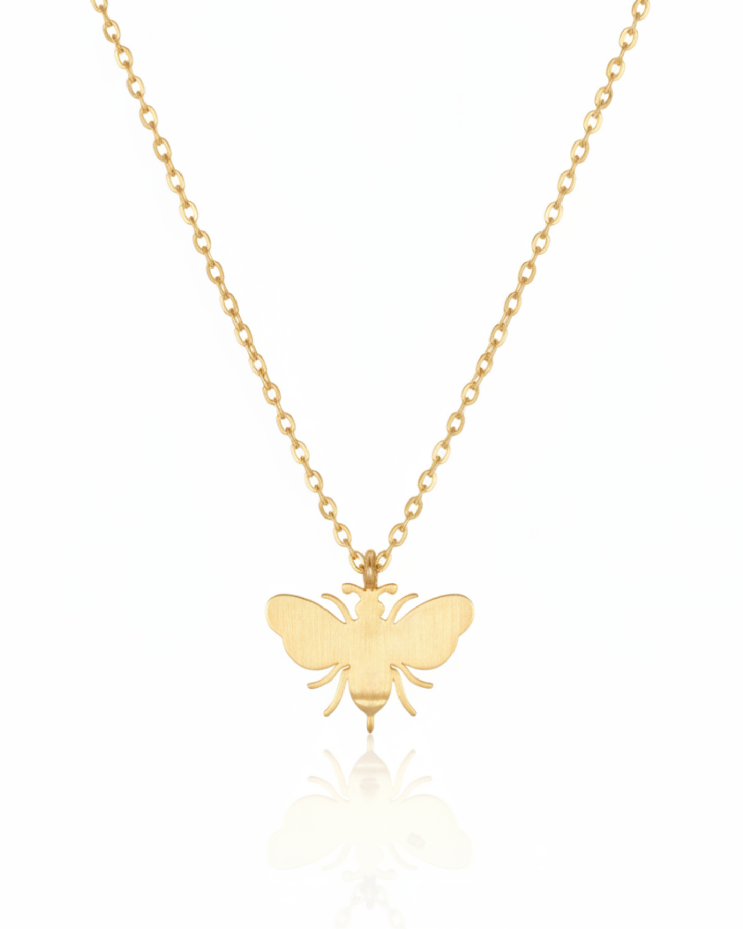 Back of The Imperial Bee Pendant showing the polished-gold bee silhouette.