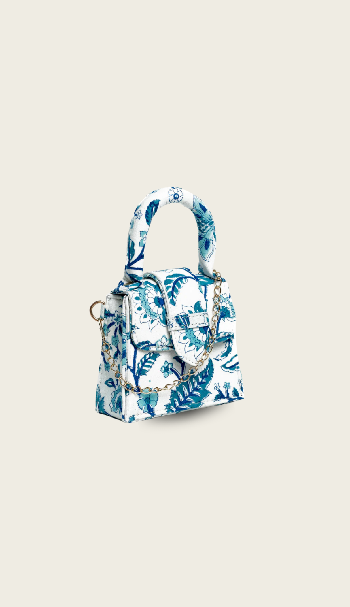 The Porto handbag carried by a model, styled for evening