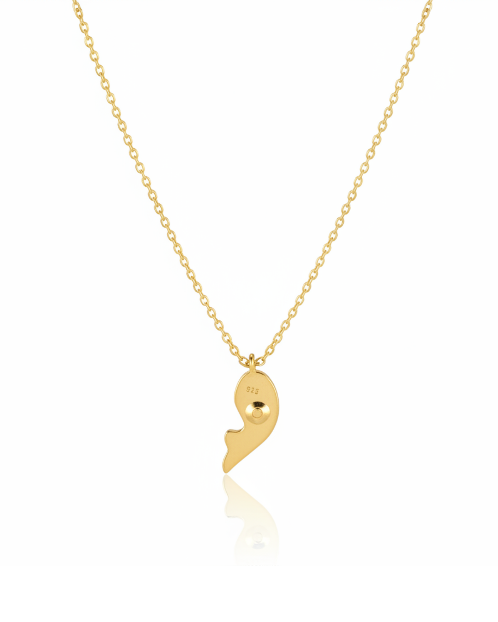 Back of The Royal Indigo Koi Pendant showing the polished-gold koi fish silhouette.