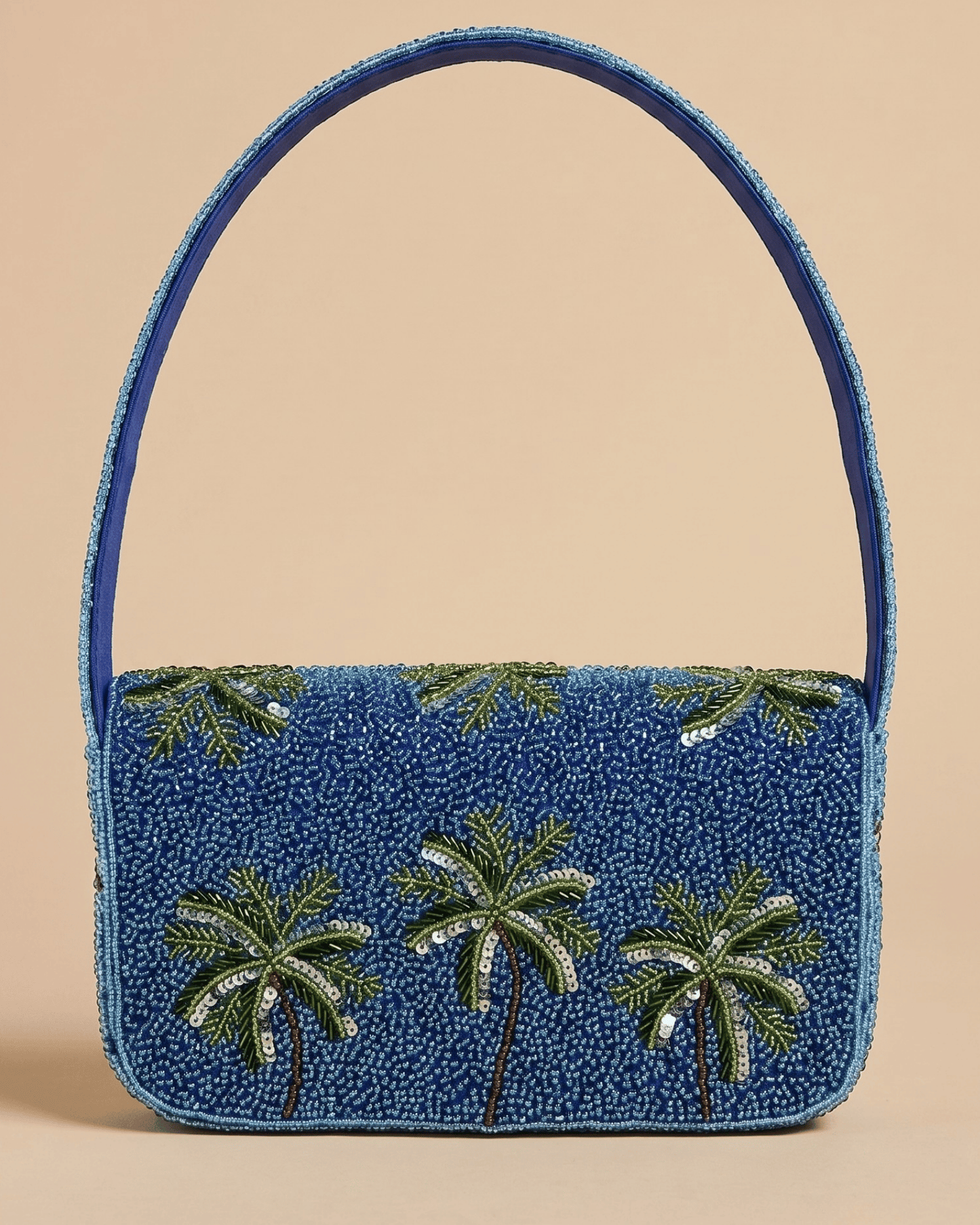 The Palma — front of the all-blue panel of the hand-beaded bag with three green sequined palm trees and a slim arched top handle.