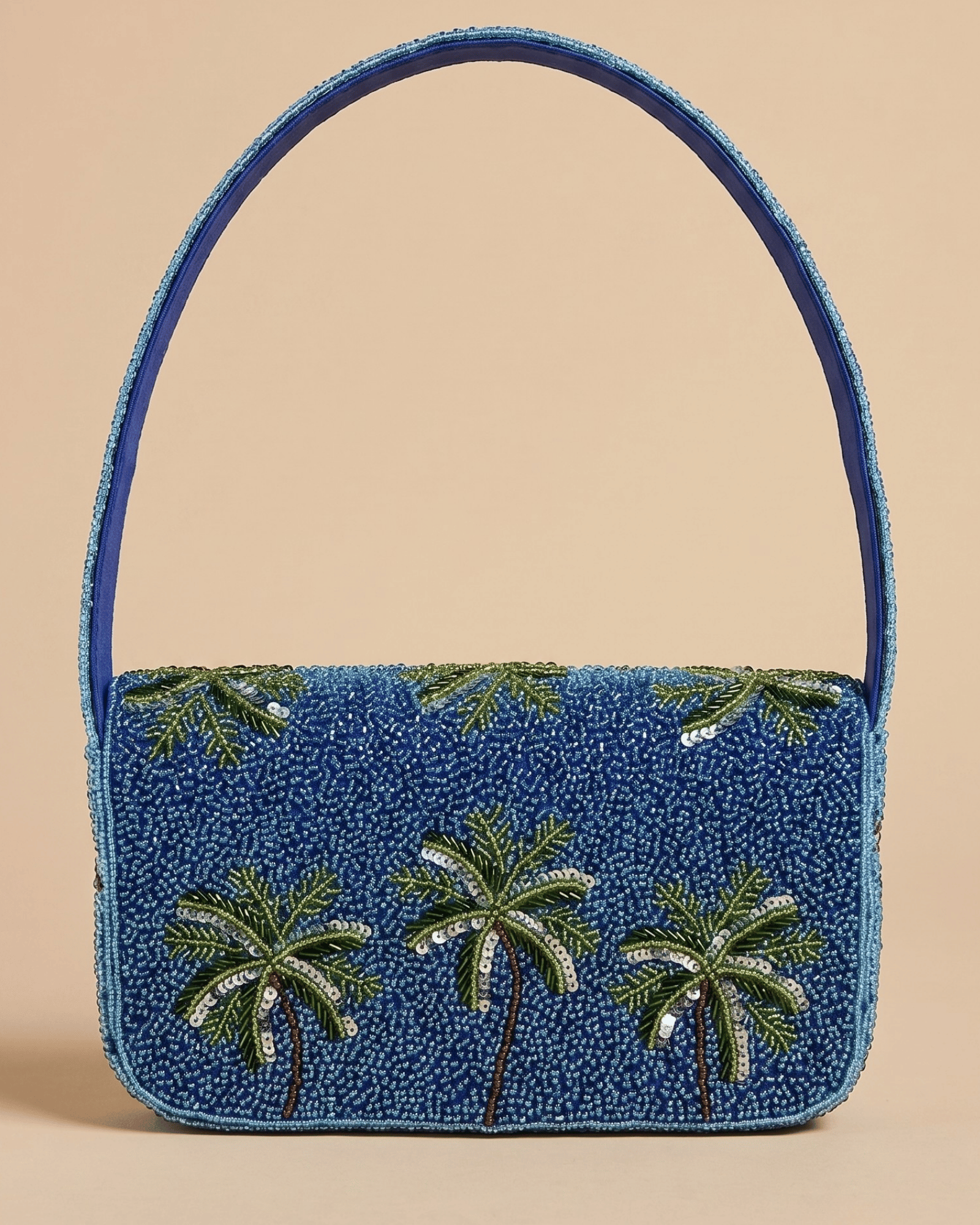 The Palma — front of the all-blue panel of the hand-beaded bag with three green sequined palm trees and a slim arched top handle.