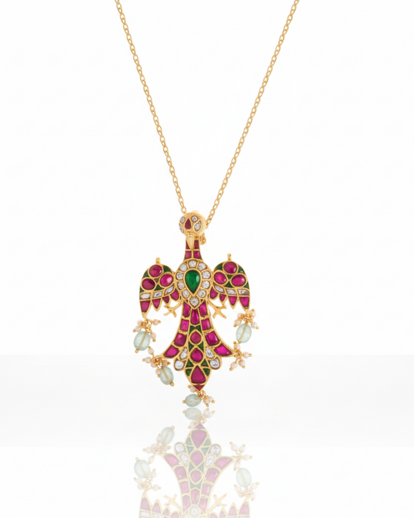 The Royal Falcon Heirloom Pendant carried by a model, styled for evening