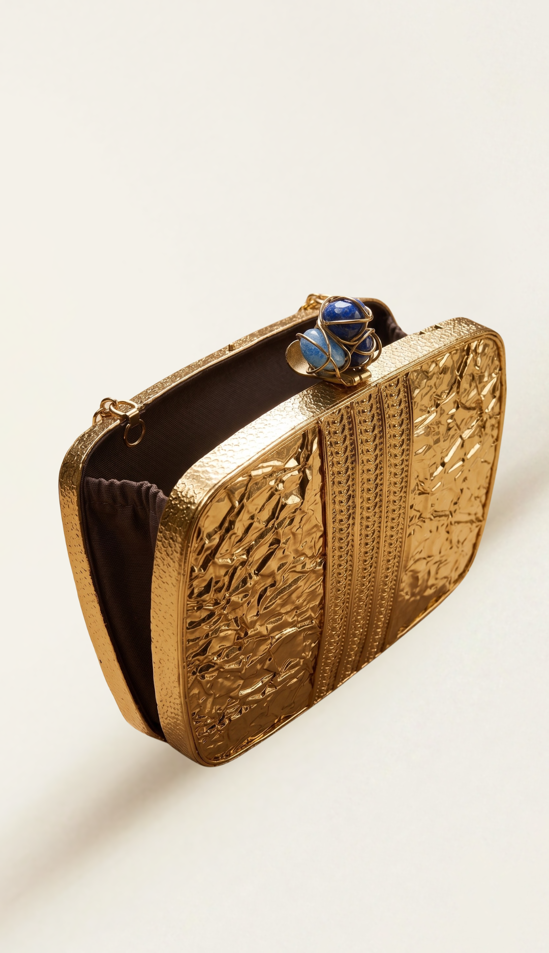 The Geode brass minaudière, three-quarter view