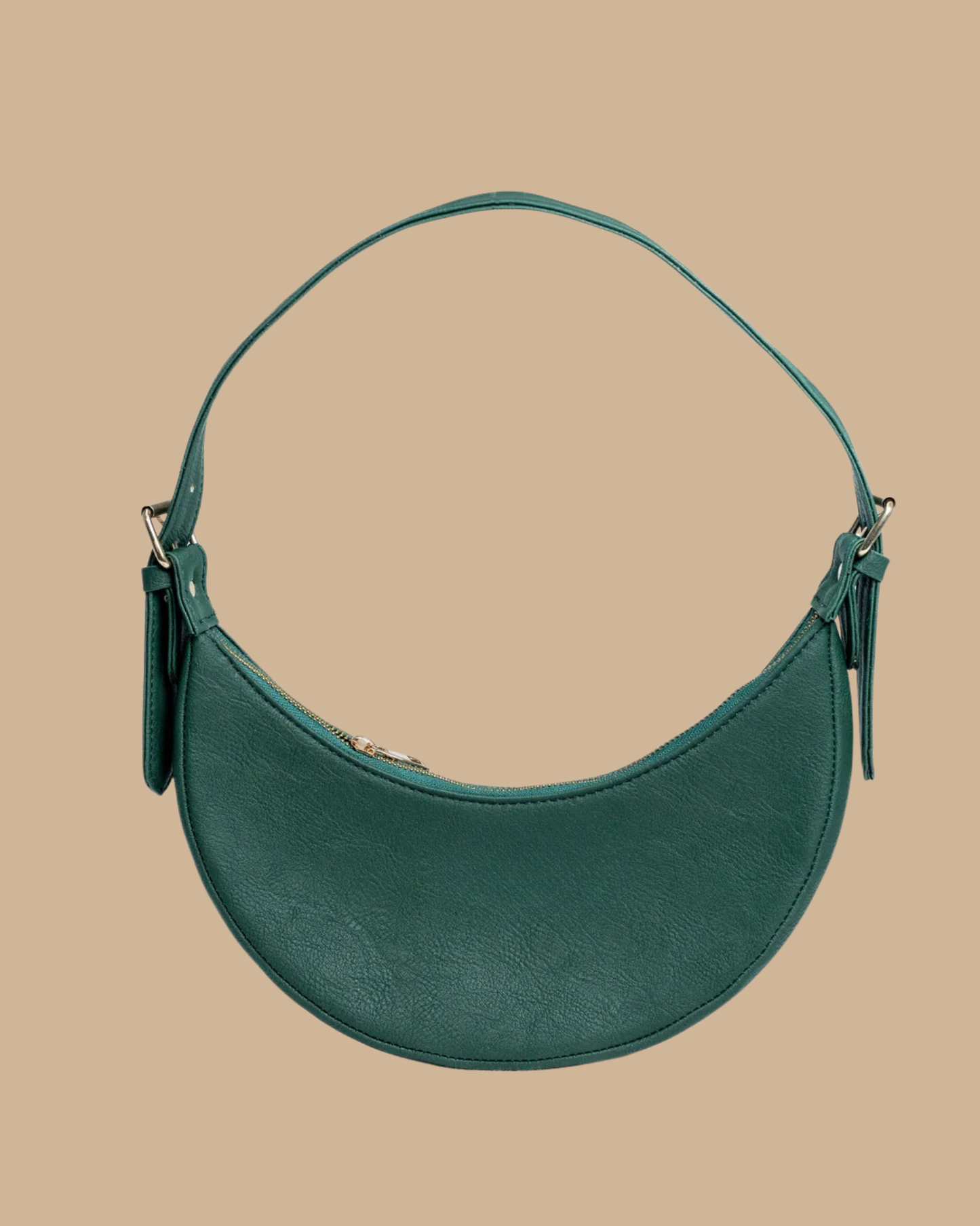 The Ivy shoulder bag — front view of the forest-green crescent leather bag