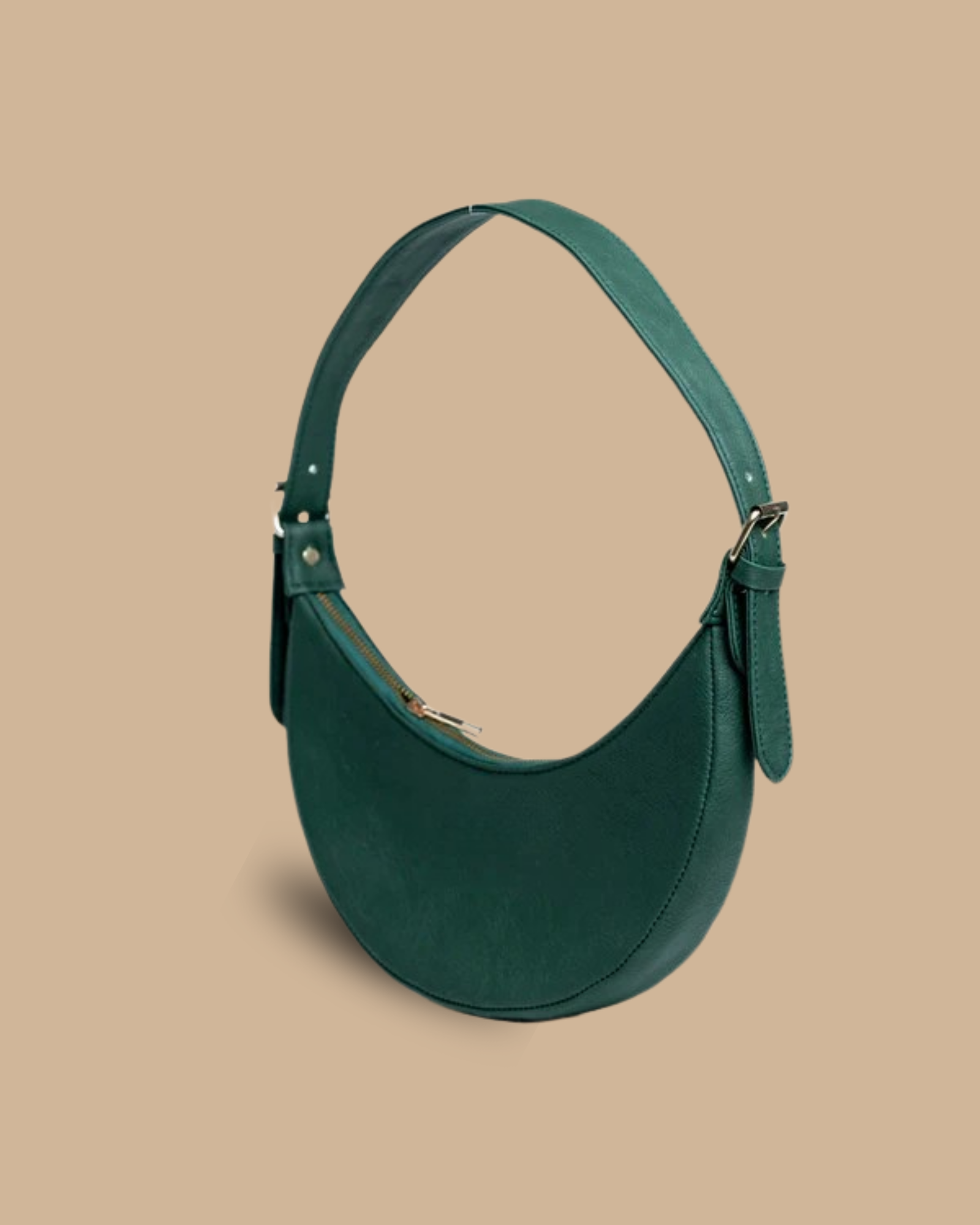 The Ivy shoulder bag — three-quarter view of the smooth leather crescent silhouette