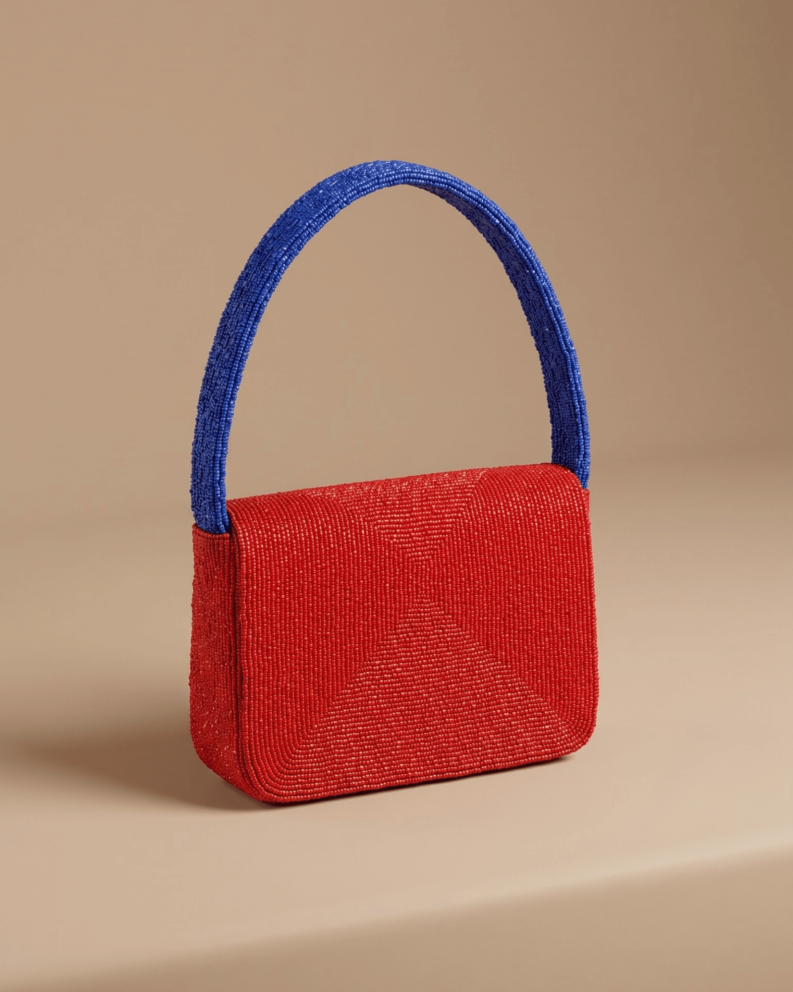 The Rally Buffalo Edition — back three-quarter view of the solid red beaded handbag with an arched royal-blue beaded top handle.