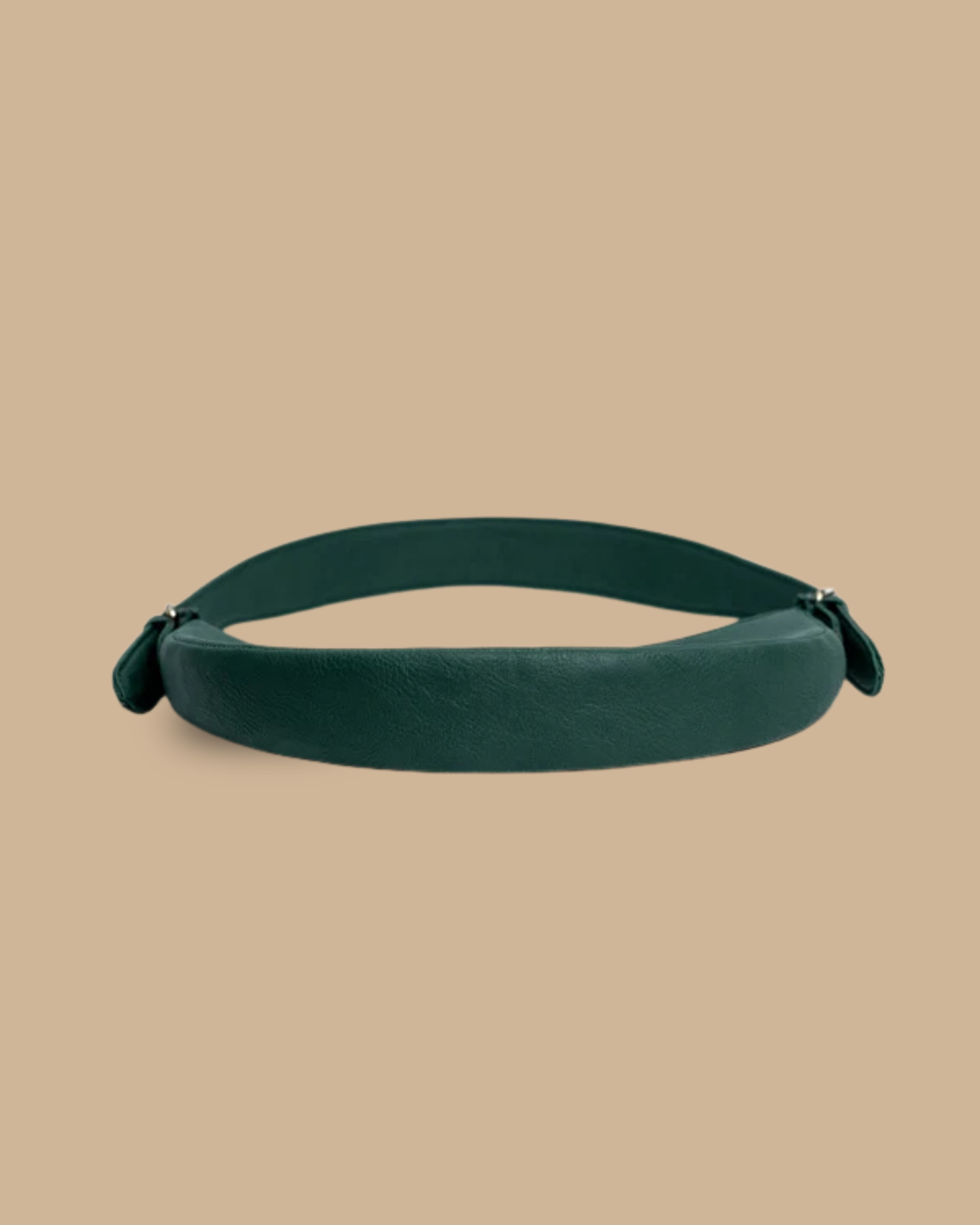 The Ivy shoulder bag — side profile of the forest-green leather crescent bag
