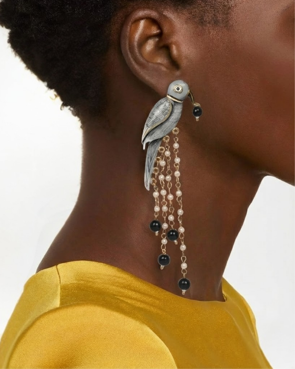 Graphite Parrot Chandelier Earrings worn by a model as an evening accessory