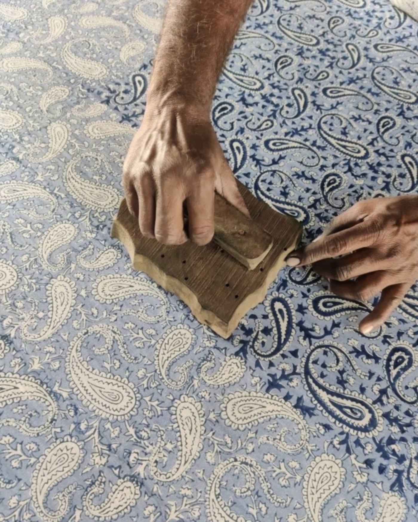 Block print atelier: hand-pressing a carved block onto indigo cotton